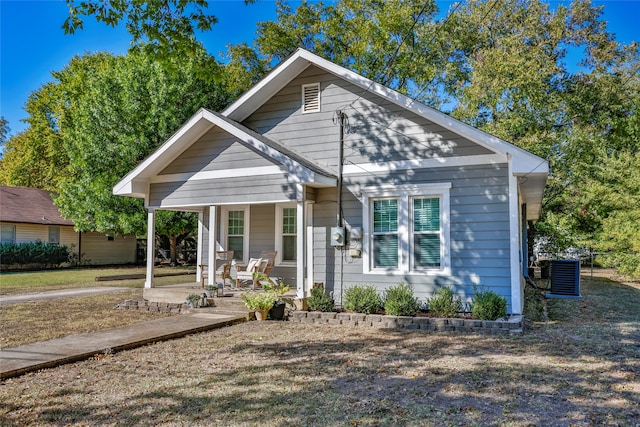 bungalow featuring central air condition unit and covered porch