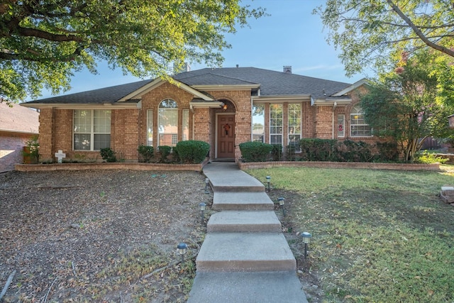 ranch-style home with a front yard