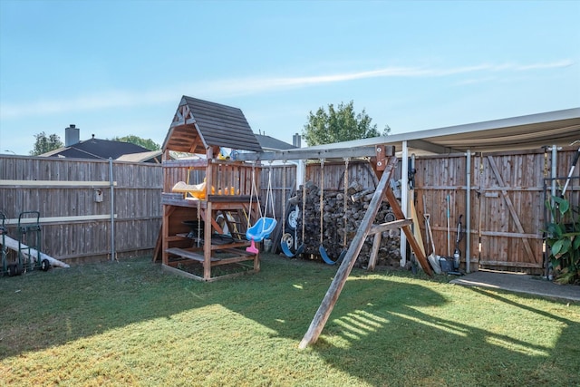 view of playground with a lawn