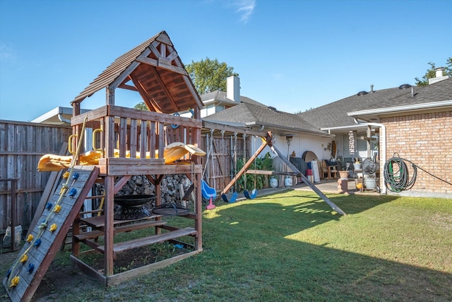 view of jungle gym featuring a lawn