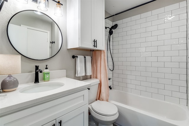 full bathroom featuring toilet, shower / bath combo with shower curtain, and vanity