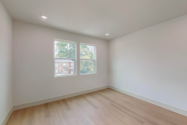 unfurnished room featuring light hardwood / wood-style flooring