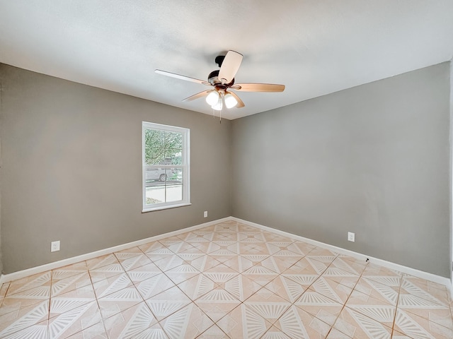 spare room with ceiling fan