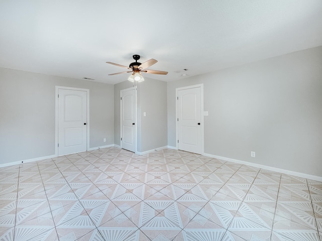 unfurnished room with ceiling fan