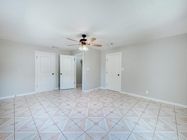 unfurnished room with ceiling fan