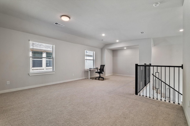 interior space featuring recessed lighting, carpet, visible vents, and baseboards