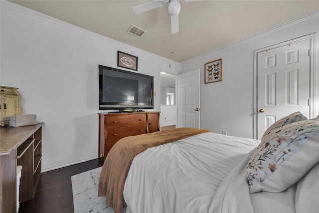 bedroom featuring ornamental molding, dark hardwood / wood-style floors, and ceiling fan