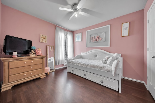 bedroom with dark hardwood / wood-style floors and ceiling fan