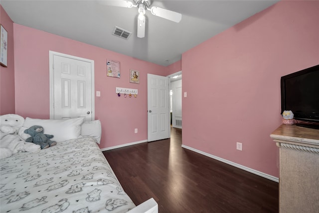 bedroom with dark hardwood / wood-style floors and ceiling fan