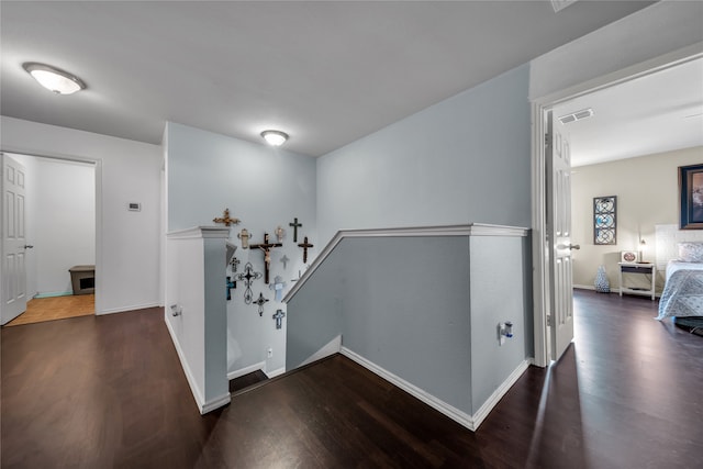 hallway with dark hardwood / wood-style floors