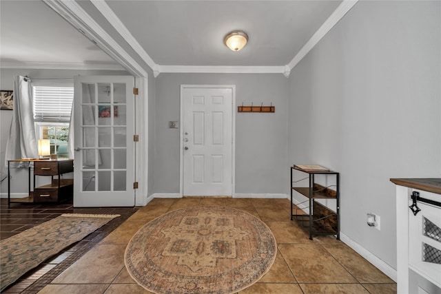 tiled foyer featuring crown molding