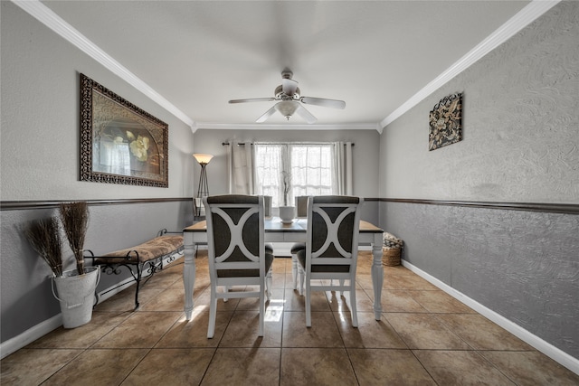 tiled dining room with crown molding and ceiling fan