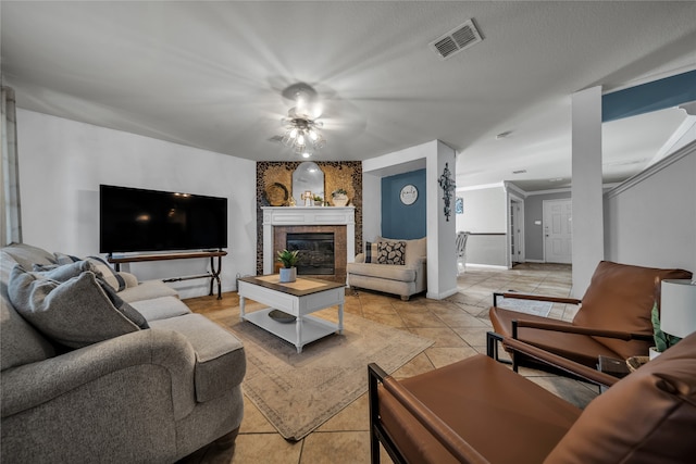 tiled living room featuring ceiling fan