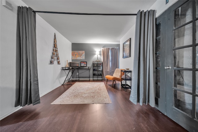 living area with dark hardwood / wood-style floors