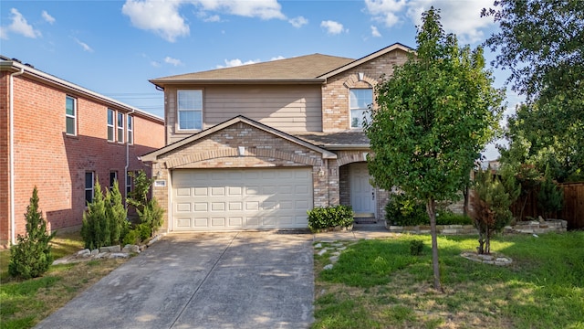 view of front property featuring a front yard and a garage