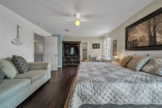 bedroom featuring dark hardwood / wood-style flooring and ceiling fan