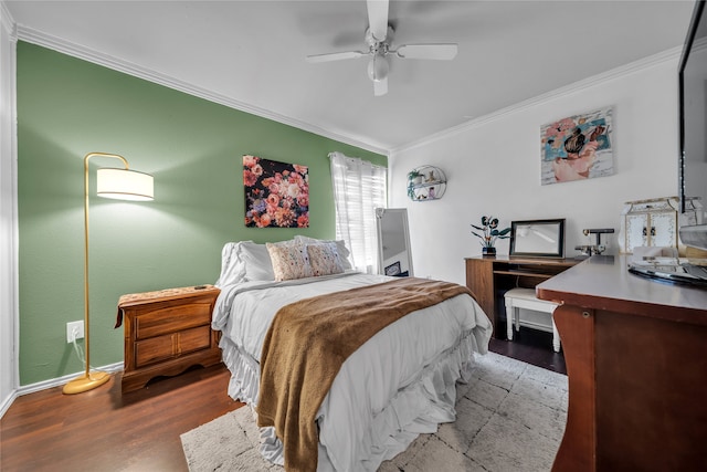 bedroom with crown molding, wood-type flooring, and ceiling fan