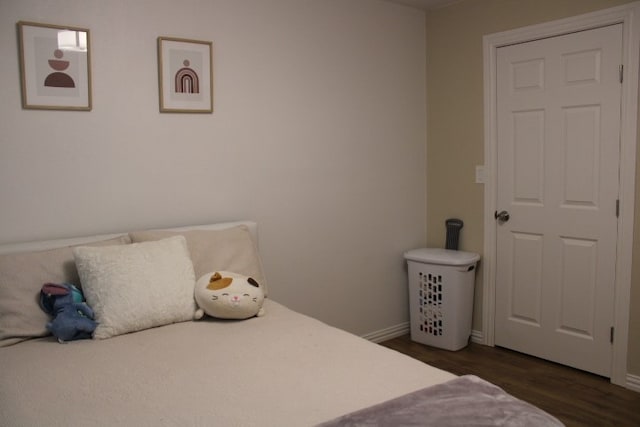 bedroom featuring dark hardwood / wood-style flooring