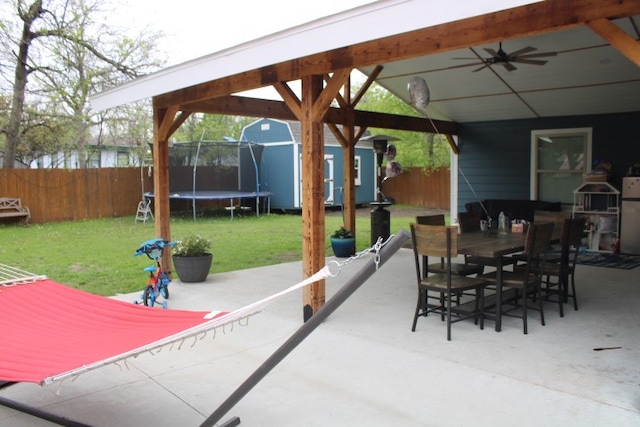 view of patio with a gazebo, a trampoline, and ceiling fan