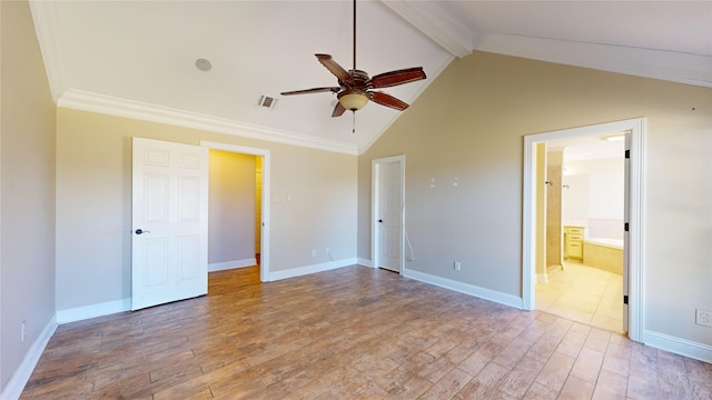 unfurnished bedroom with lofted ceiling with beams, ceiling fan, hardwood / wood-style flooring, and ensuite bath