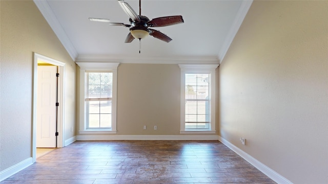 empty room featuring crown molding, wood-type flooring, and ceiling fan