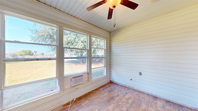 unfurnished sunroom with ceiling fan, cooling unit, and wooden ceiling