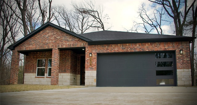 single story home featuring a garage