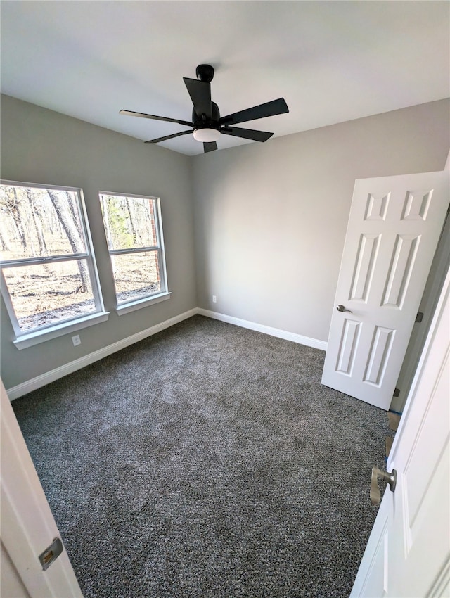 carpeted empty room with ceiling fan