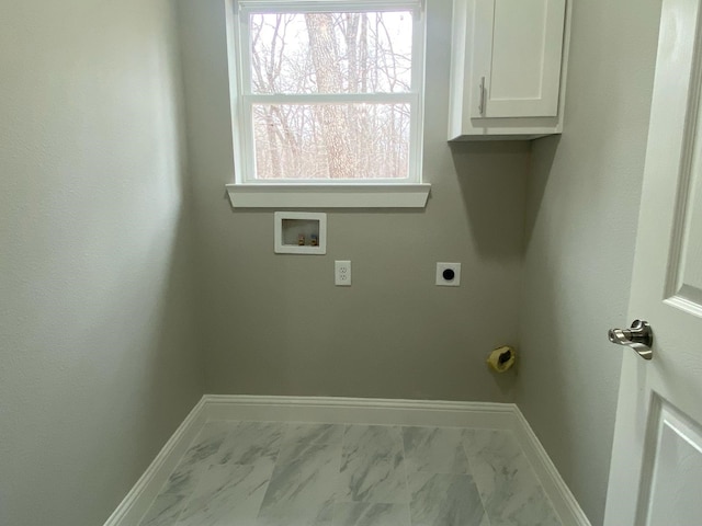 laundry room featuring hookup for an electric dryer, hookup for a washing machine, and cabinets