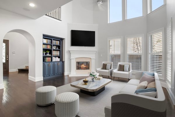 living room with dark hardwood / wood-style floors, a high ceiling, and ceiling fan