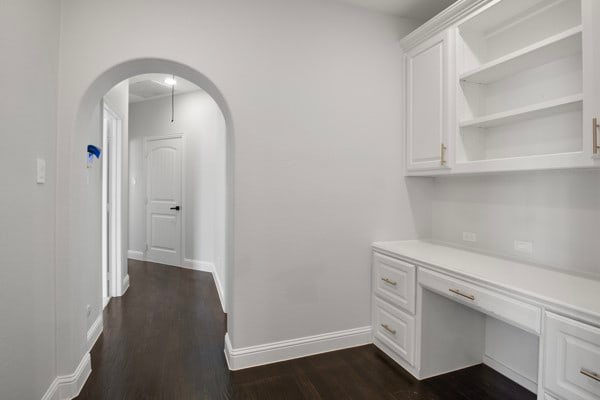 corridor with dark wood-type flooring