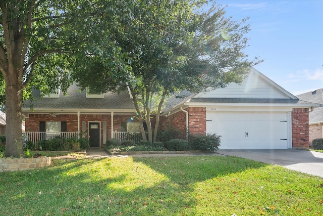 view of front of home with a porch, a front yard, and a garage