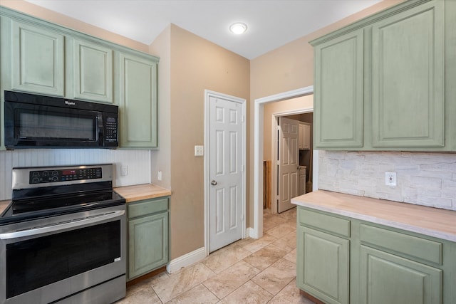 kitchen with wooden counters, stainless steel range with electric stovetop, green cabinets, and backsplash