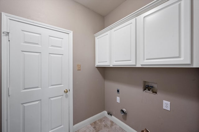 laundry room featuring electric dryer hookup, washer hookup, cabinets, and gas dryer hookup