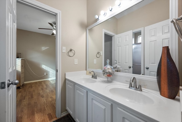 bathroom with vanity, hardwood / wood-style floors, and ceiling fan