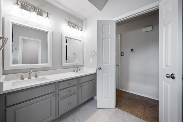 bathroom with vanity and tile patterned flooring