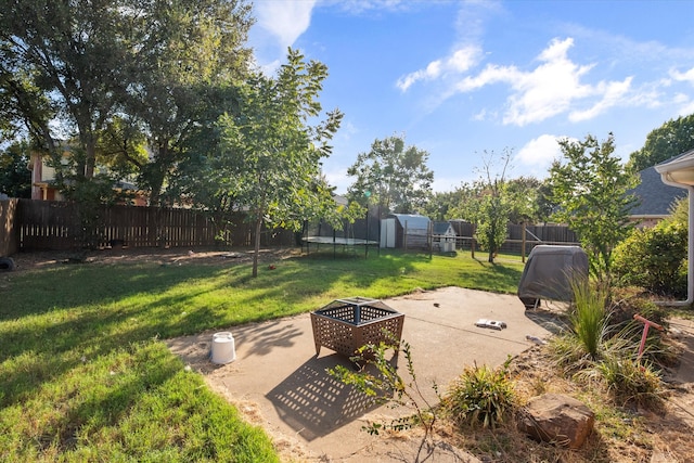 view of yard featuring a patio area and a trampoline