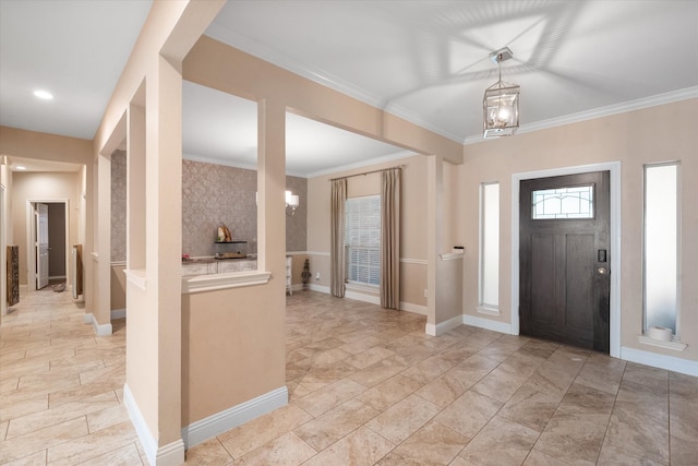 foyer entrance featuring ornamental molding