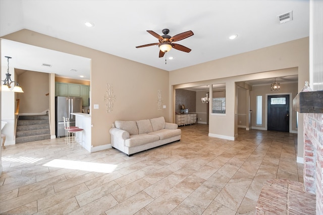 unfurnished living room with ceiling fan