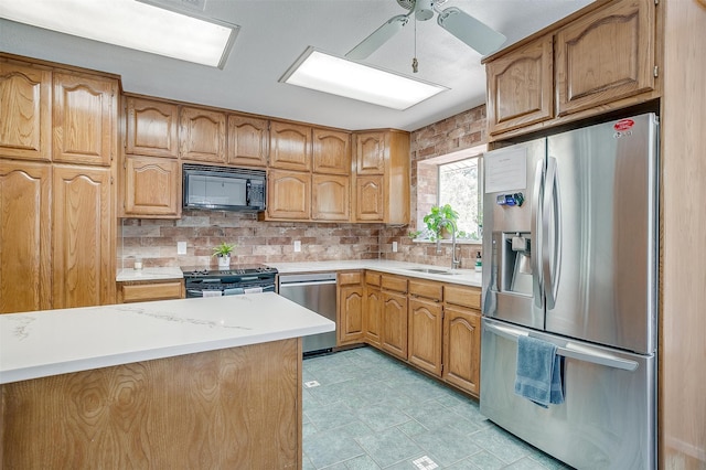 kitchen featuring black appliances, ceiling fan, sink, and tasteful backsplash