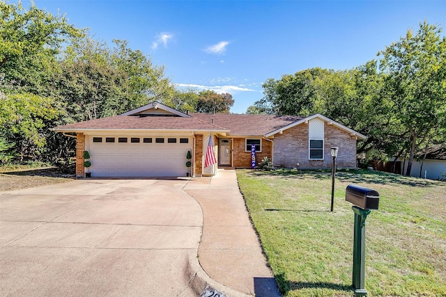 single story home featuring a garage and a front lawn