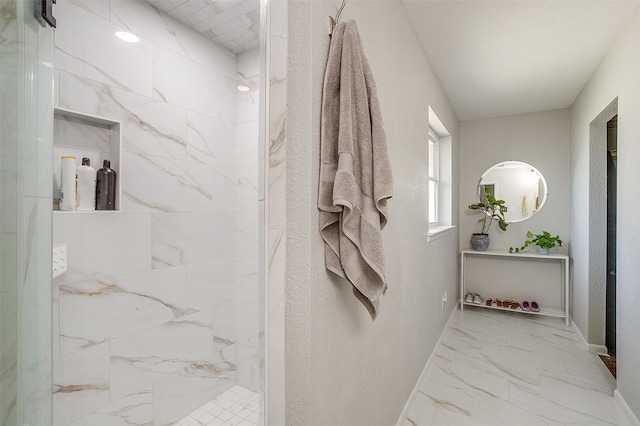 bathroom with tiled shower