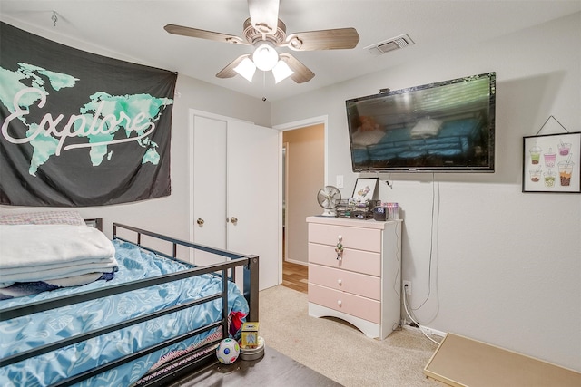 carpeted bedroom featuring ceiling fan