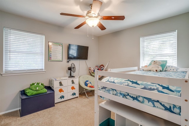 carpeted bedroom with ceiling fan