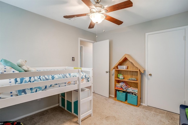 carpeted bedroom with ceiling fan