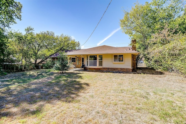 ranch-style home with a front yard