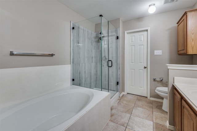 full bathroom featuring vanity, shower with separate bathtub, toilet, and tile patterned flooring