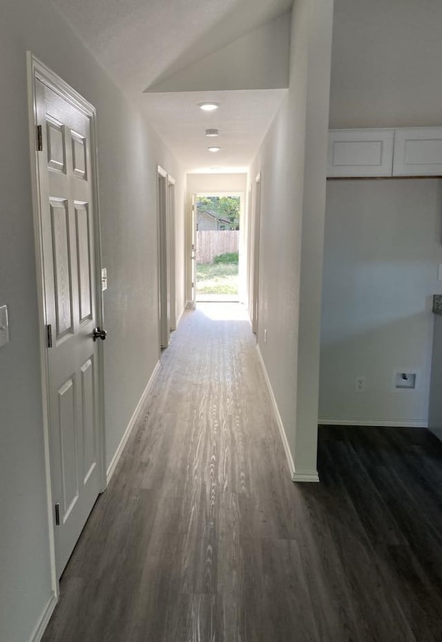 corridor with dark wood-type flooring