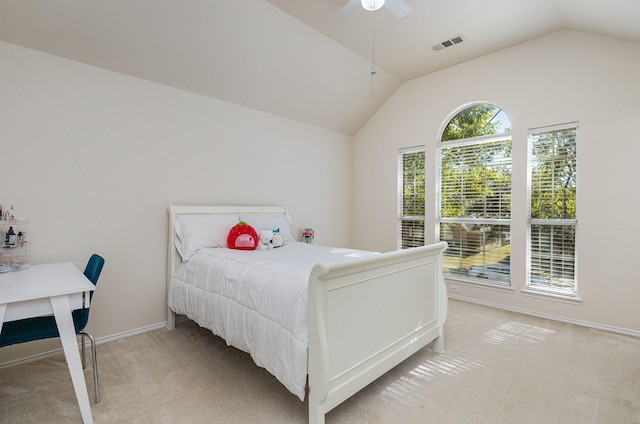 bedroom featuring visible vents, light carpet, a ceiling fan, baseboards, and vaulted ceiling