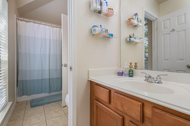 full bathroom with tile patterned flooring, toilet, and vanity